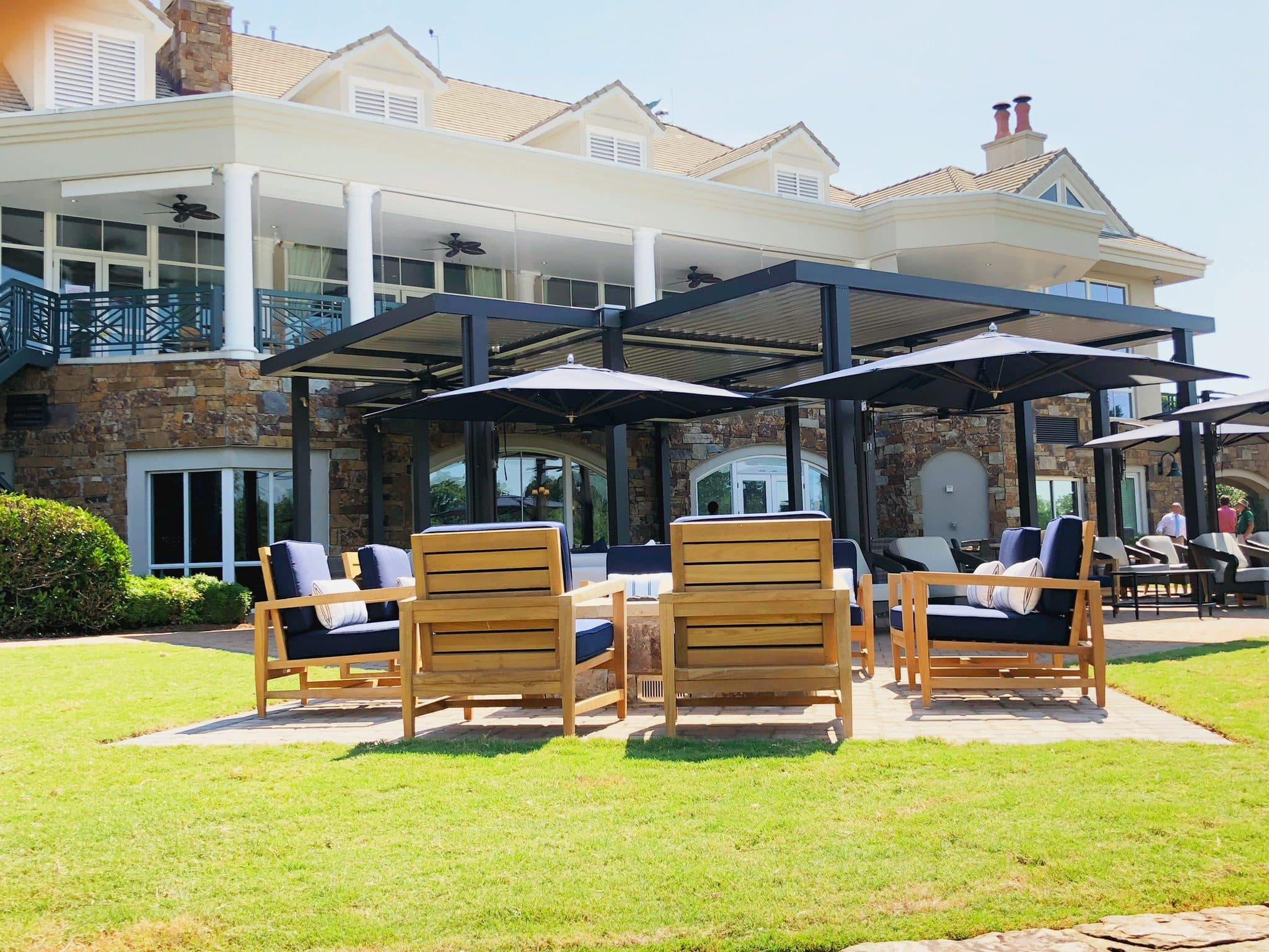 Equinox louvered roof over a backyard seating area