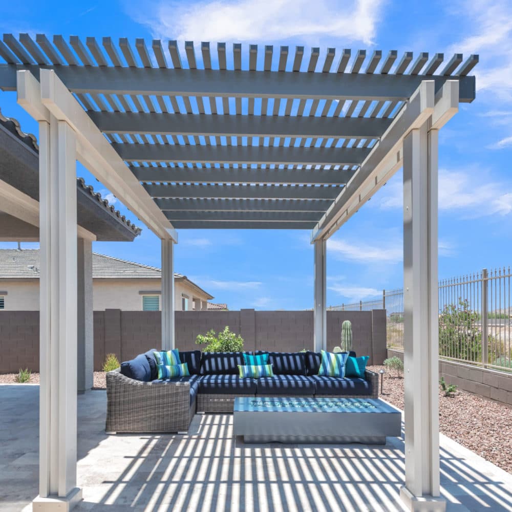 Freestanding graphite Alumawood lattice cover over an outdoor sofa